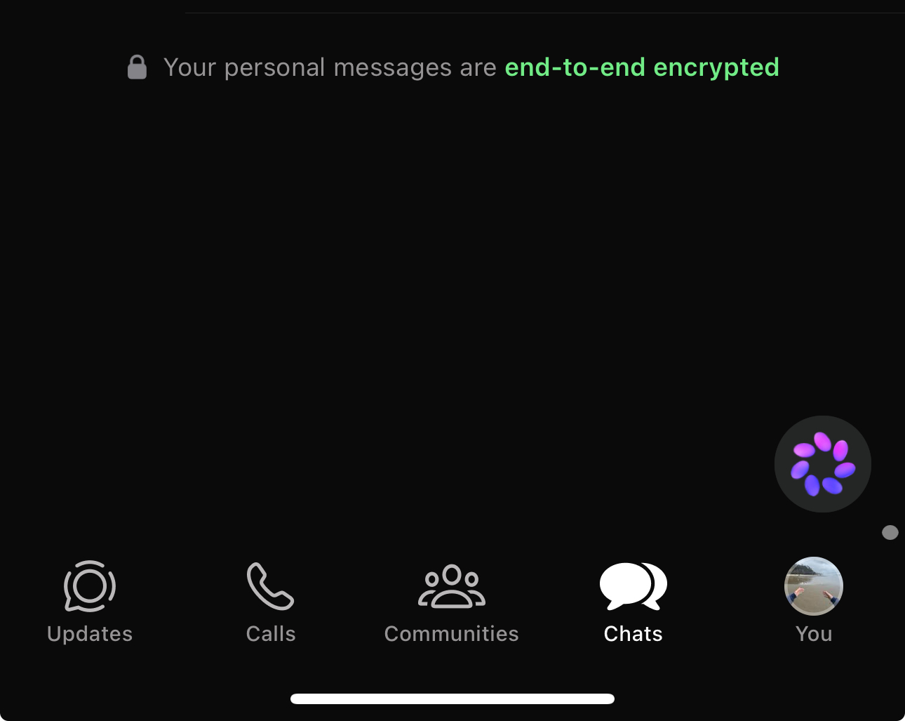 WhatsApp chats tab showing a Meta AI spinner under the end-to-end encryption notice
